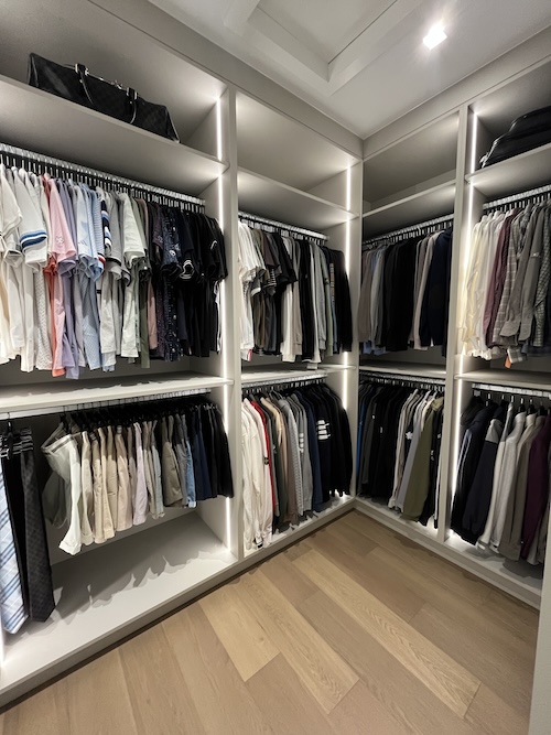 closet with hanging clothes