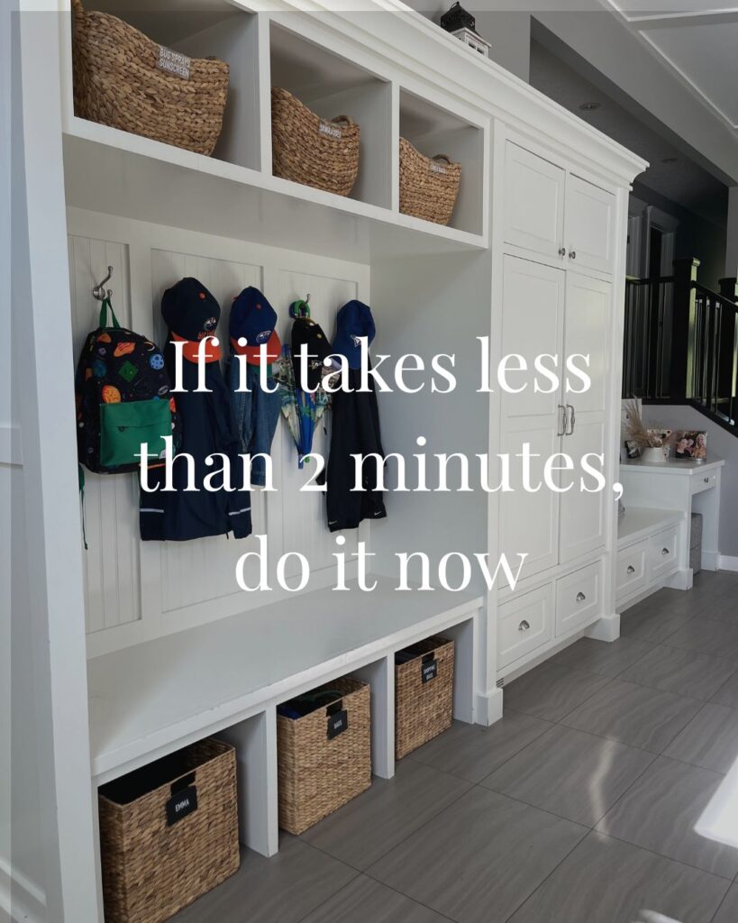 All inclusive mudroom organization in Aspen Woods, Calgary featuring coordinated baskets and custom labels for a high functioning entryway.