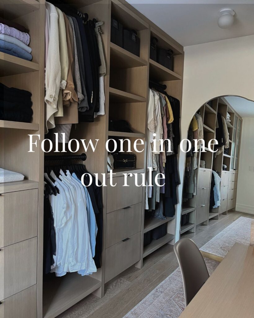 A luxury walk-in closet in Aspen Woods, Calgary featuring coordinated hangers and colour coded system.