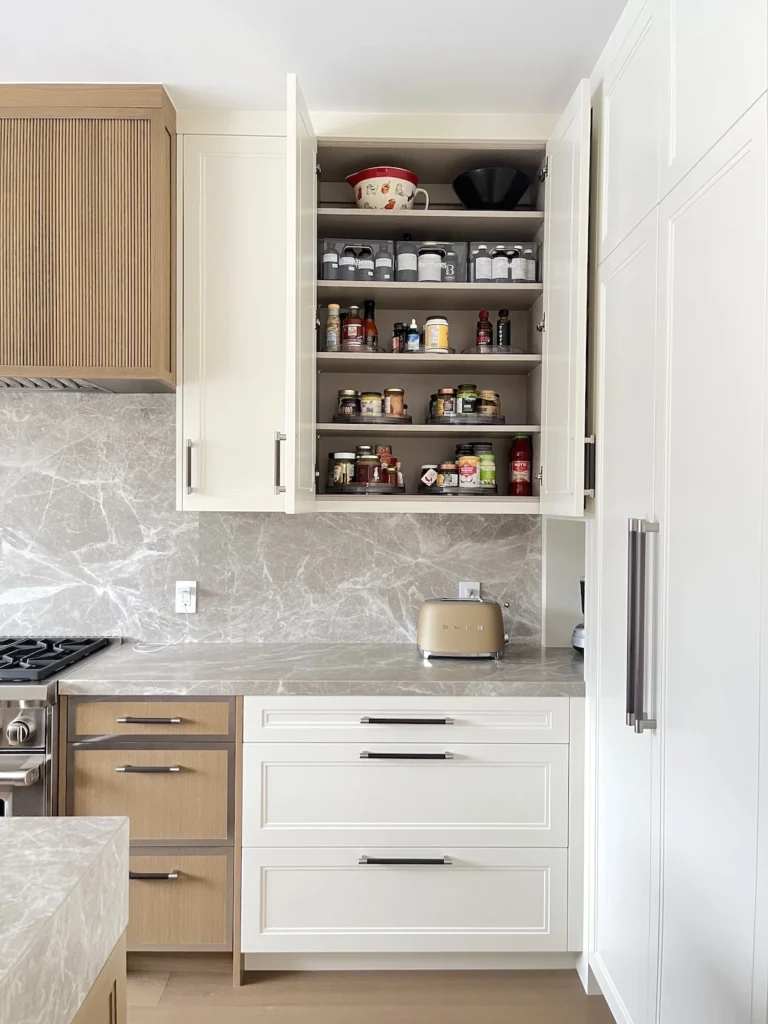 Kitchen storage systems in Mount Royal using lazy susan organizers to maximize cabinet space and accessibility.