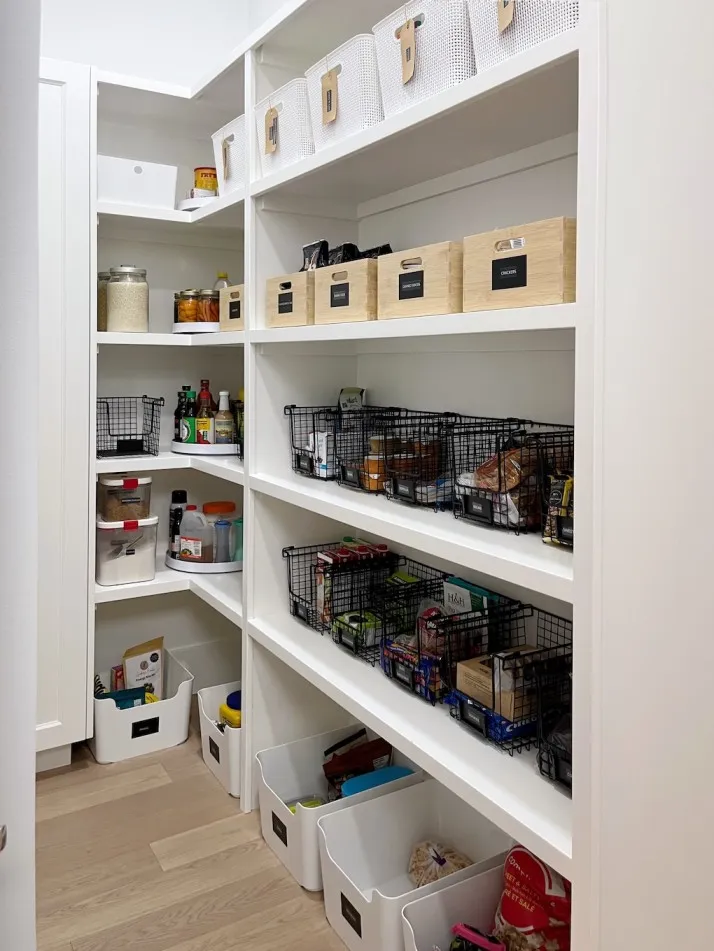 Walk-in pantry organization in Altadore, featuring an airy, light-filled design that brings a sense of calm to a busy family kitchen