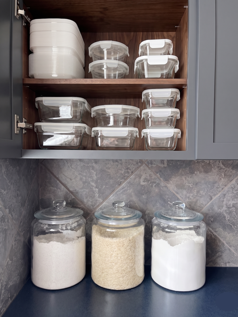 Tupperware storage in the kitchen cabinet