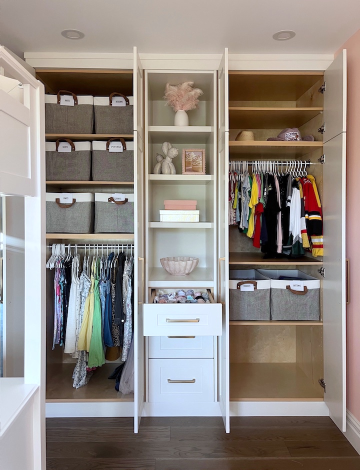 ADHD-friendly walk-in closet organization with open fabric storage bins and accessible clothing hanging racks.