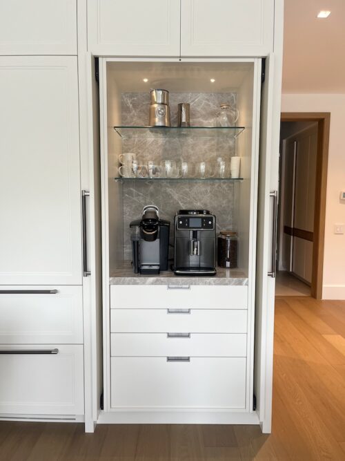 Organized coffee station and glassware cabinet with functional open shelving