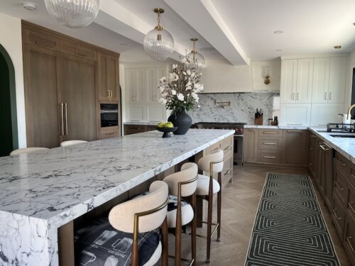 Decluttered and spacious kitchen island with clear countertops in modern Calgary residence